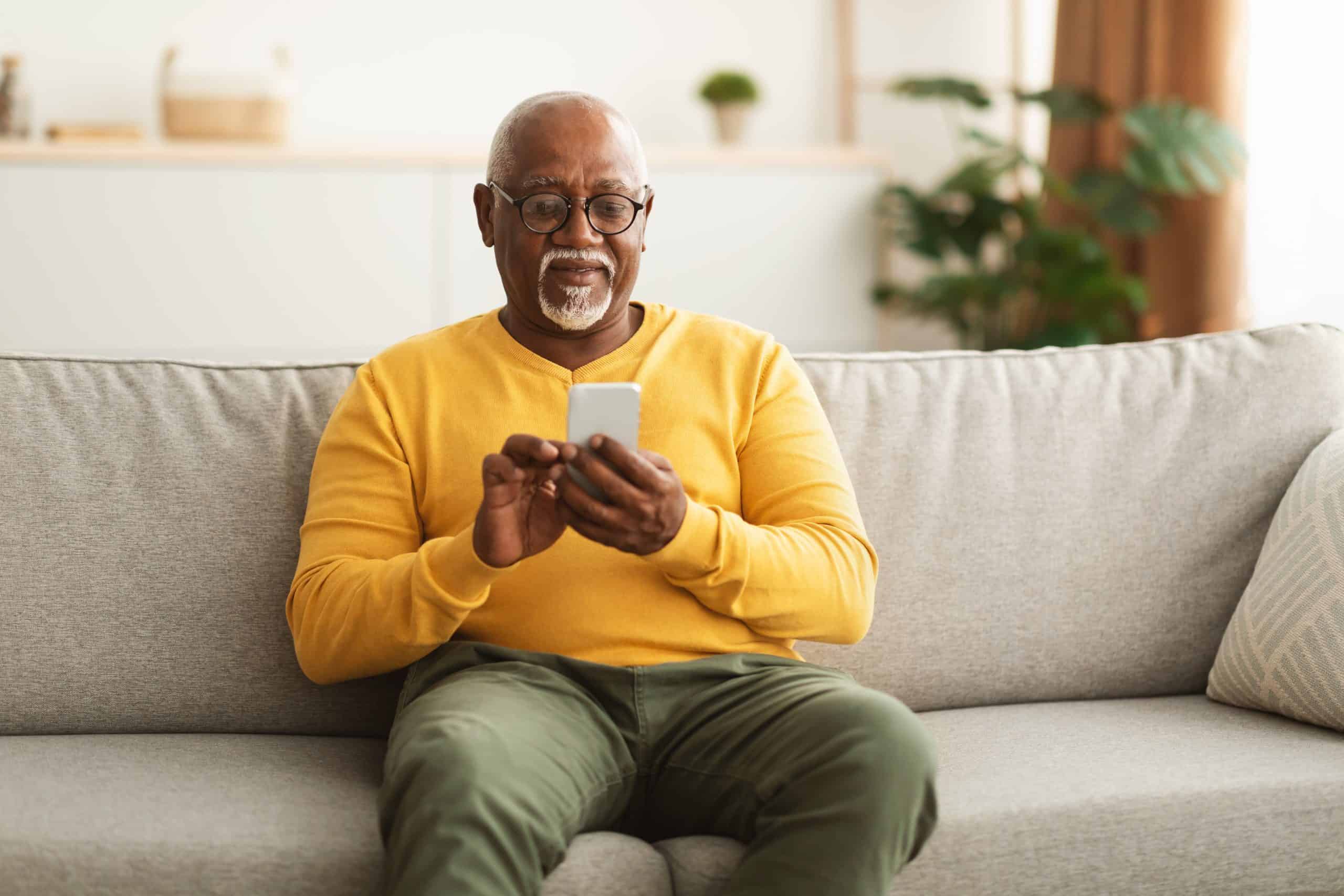 A senior man looking at his phone A senior man looking at his phone